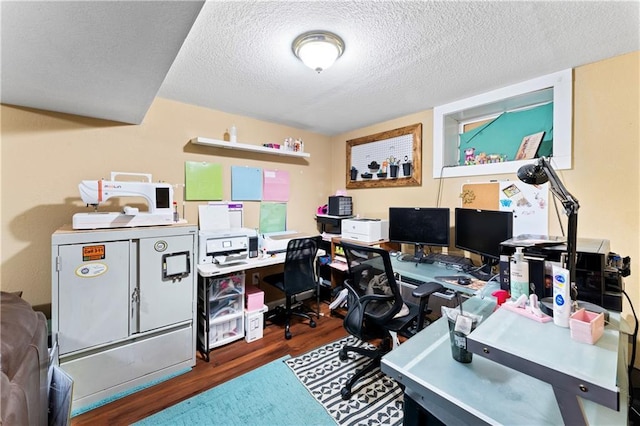 home office featuring wood finished floors and a textured ceiling