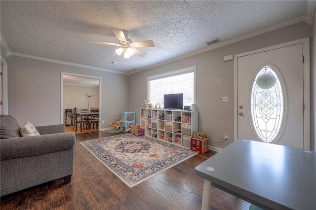 living room with ornamental molding, a textured ceiling, ceiling fan, and dark hardwood / wood-style flooring