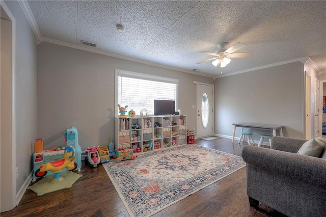 living room with dark wood-type flooring, ceiling fan, and ornamental molding