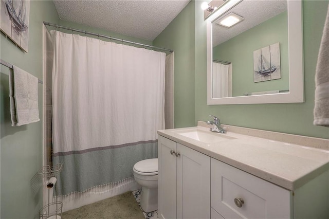 bathroom with vanity, curtained shower, toilet, and a textured ceiling