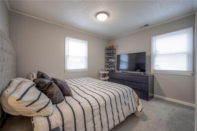 carpeted bedroom featuring crown molding and a textured ceiling