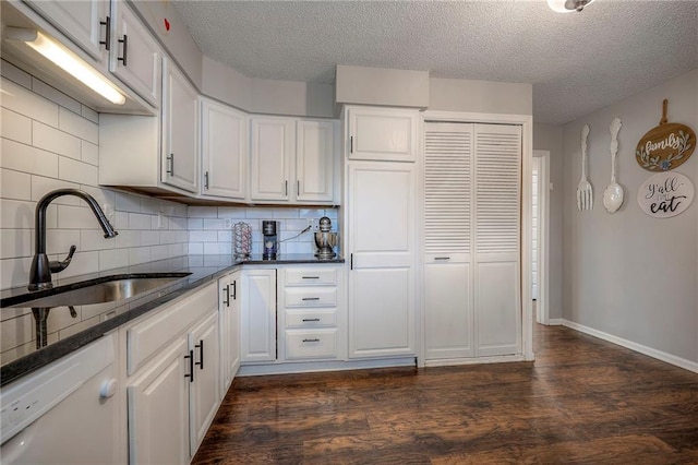 kitchen featuring white cabinetry, sink, and dark hardwood / wood-style flooring