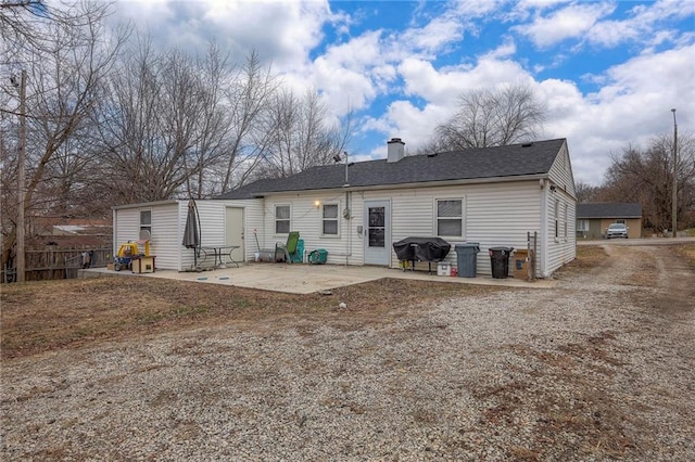 rear view of property featuring a patio