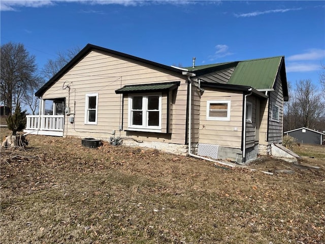 back of house with a porch