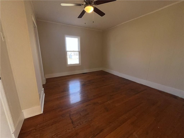 unfurnished room with crown molding, ceiling fan, and dark hardwood / wood-style flooring