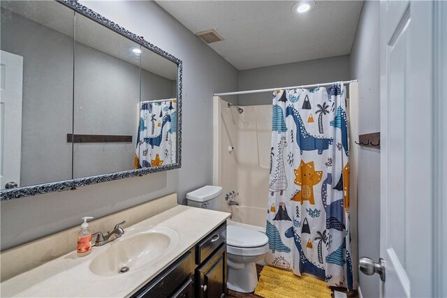 full bathroom with vanity, shower / tub combo, and toilet