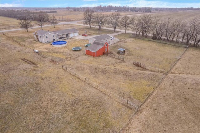 birds eye view of property with a rural view