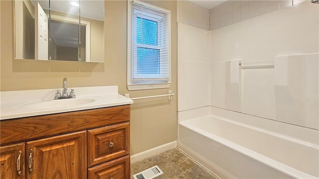 bathroom featuring vanity and shower / bath combination