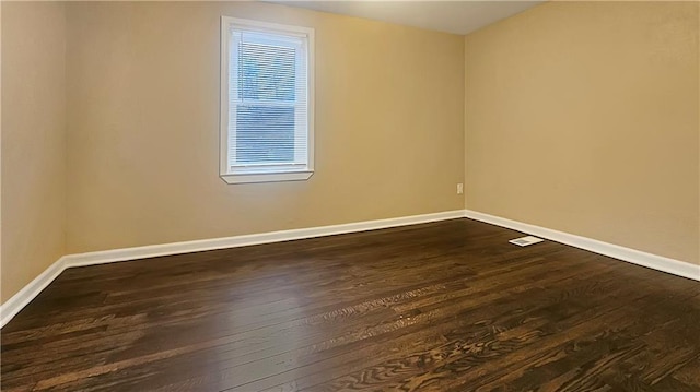 unfurnished room featuring dark hardwood / wood-style floors