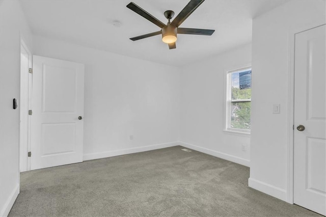 unfurnished bedroom featuring light colored carpet and ceiling fan