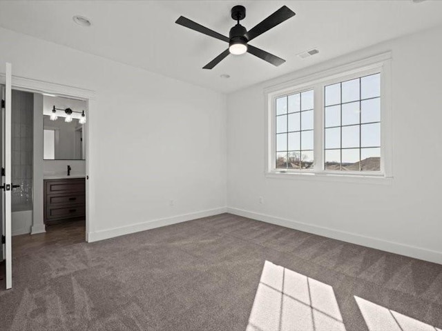 unfurnished bedroom with carpet flooring, visible vents, and baseboards