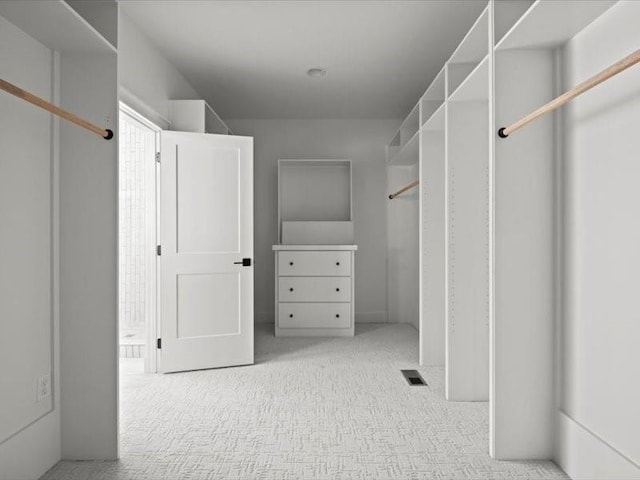 walk in closet with visible vents