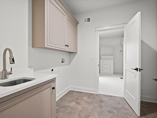 clothes washing area with washer hookup, visible vents, cabinet space, hookup for an electric dryer, and a sink