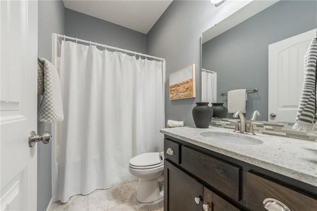 bathroom featuring toilet and vanity