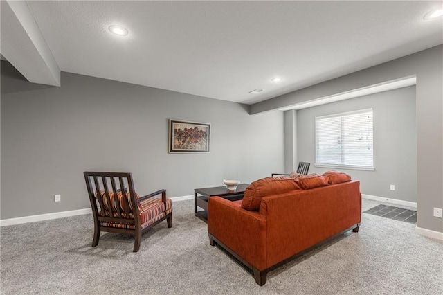 carpeted living room with baseboards and recessed lighting