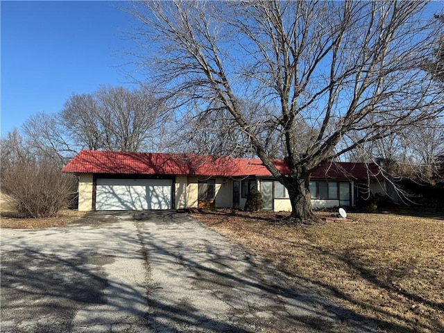 single story home with a garage