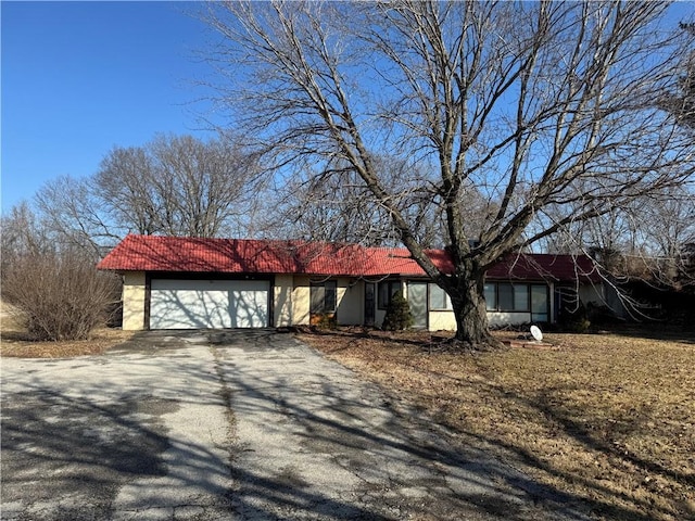 single story home with a garage