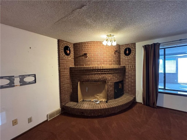 room details featuring a fireplace, carpet flooring, and a textured ceiling