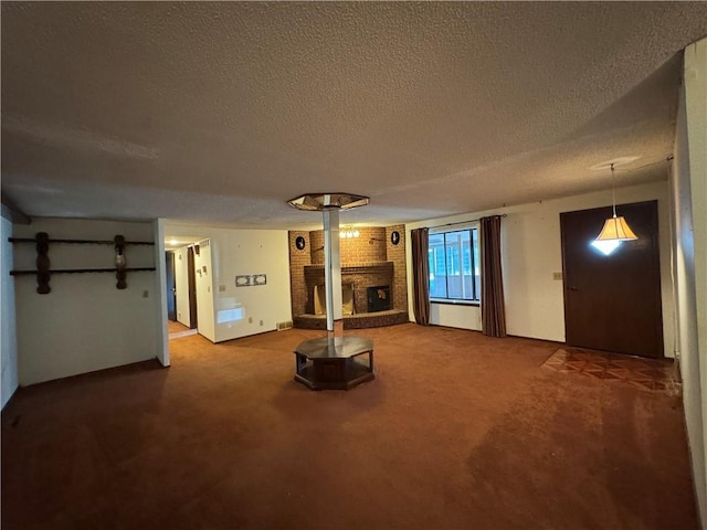 unfurnished living room with a fireplace, a textured ceiling, and carpet