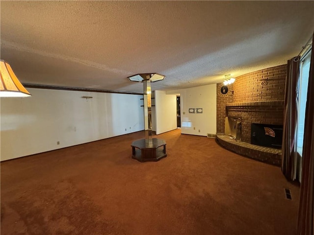 unfurnished living room featuring carpet floors, a textured ceiling, and a fireplace