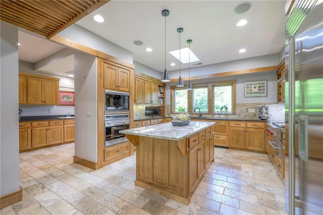 18402 W 64th St, Shawnee, KS 66218 - kitchen featuring stainless steel appliances, stone tile flooring, open shelves, a sink, and recessed lighting