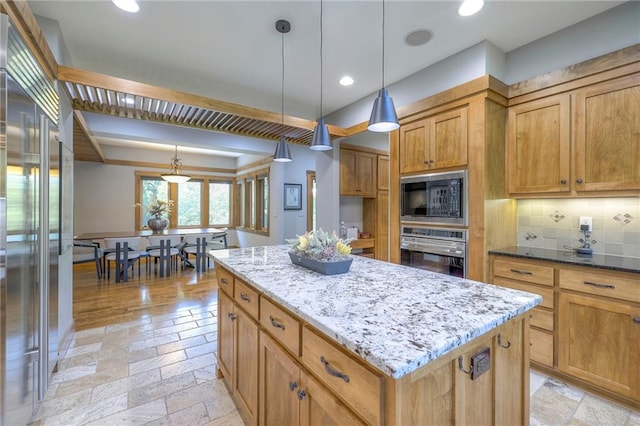 18402 W 64th St, Shawnee, KS 66218 - kitchen with built in appliances, stone tile floors, light stone countertops, a kitchen island, and recessed lighting