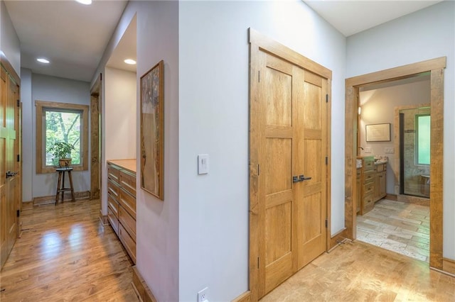 18402 W 64th St, Shawnee, KS 66218 - hallway featuring light wood-style floors, recessed lighting, and baseboards