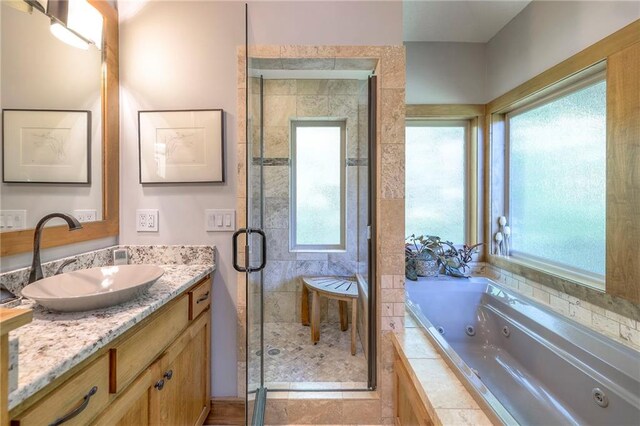 18402 W 64th St, Shawnee, KS 66218 - bathroom featuring a stall shower, vanity, and a jetted tub