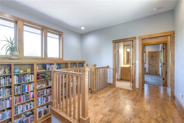 18402 W 64th St, Shawnee, KS 66218 - corridor featuring wood finished floors, baseboards, and recessed lighting