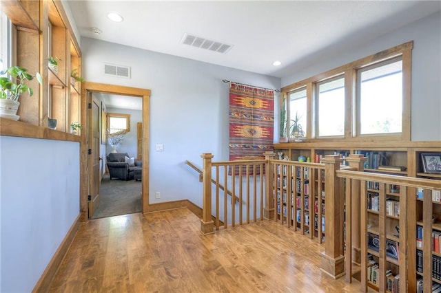 18402 W 64th St, Shawnee, KS 66218 - hallway featuring an upstairs landing, wood finished floors, recessed lighting, and baseboards