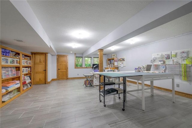 18402 W 64th St, Shawnee, KS 66218 - rec room with ornate columns, a textured ceiling, and baseboards