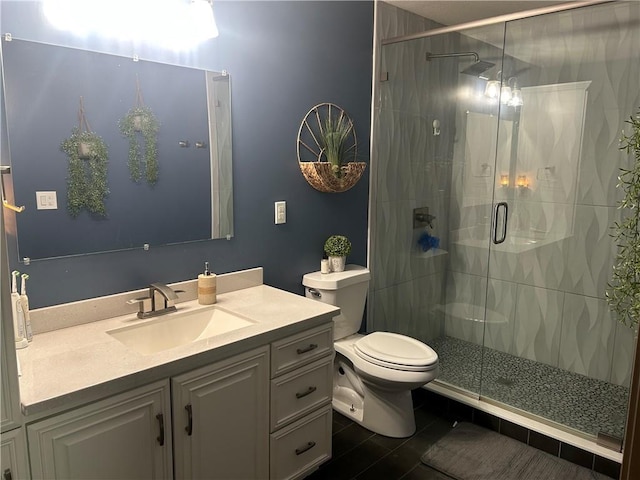 full bathroom with toilet, a shower stall, and vanity