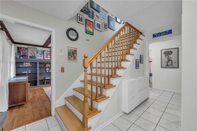 stairway with tile patterned flooring