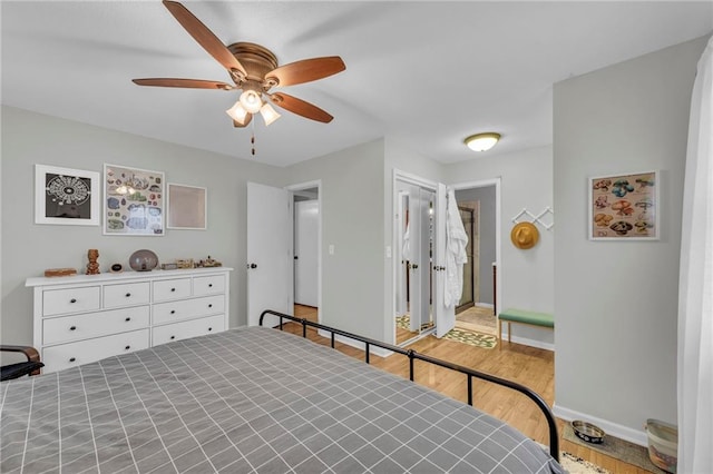 bedroom featuring ceiling fan and light hardwood / wood-style floors