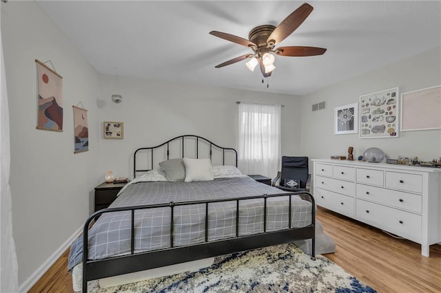 bedroom featuring light hardwood / wood-style flooring and ceiling fan