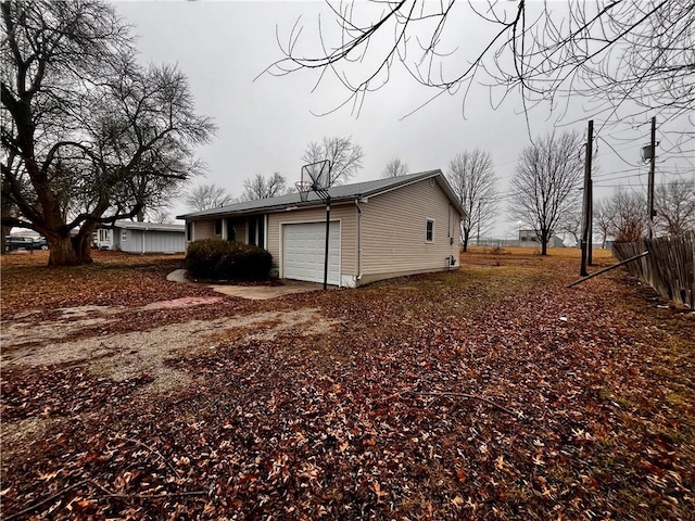 view of property exterior featuring a garage