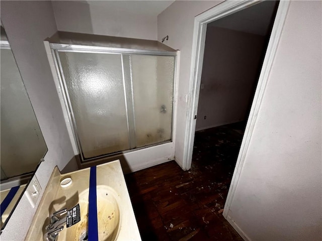 bathroom featuring vanity, shower / bath combination with glass door, and hardwood / wood-style floors