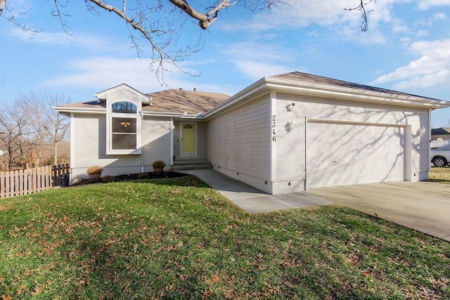 ranch-style home with a garage and a front yard