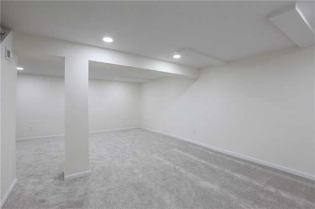 finished basement featuring carpet floors, visible vents, baseboards, and recessed lighting