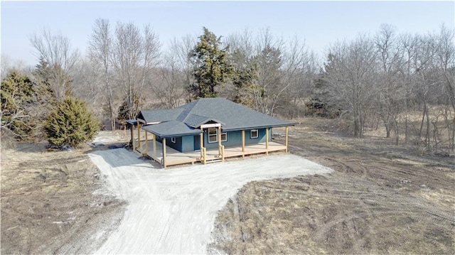 farmhouse-style home with driveway