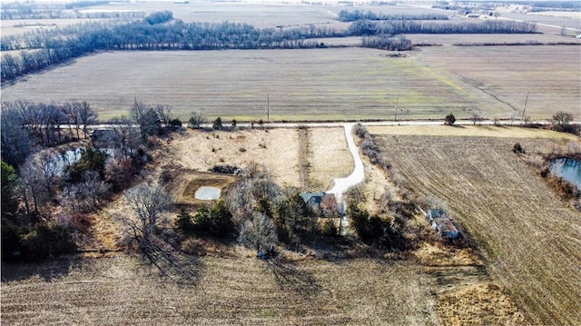 birds eye view of property with a rural view