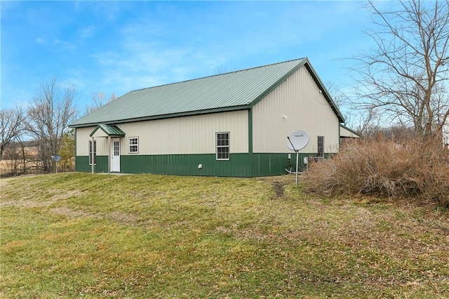 view of home's exterior with a lawn