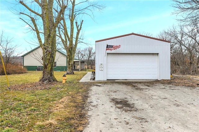 garage with a yard