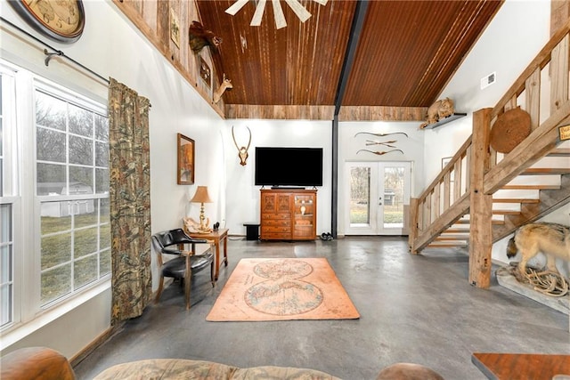 living room featuring wood ceiling, high vaulted ceiling, french doors, and ceiling fan