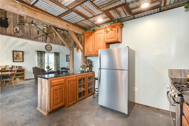 kitchen featuring ceiling fan and appliances with stainless steel finishes