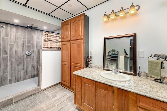 bathroom featuring vanity and a tile shower