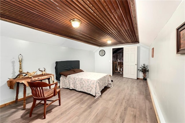 bedroom with wooden ceiling, vaulted ceiling, and light wood-type flooring