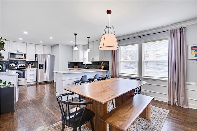 dining room featuring dark hardwood / wood-style flooring