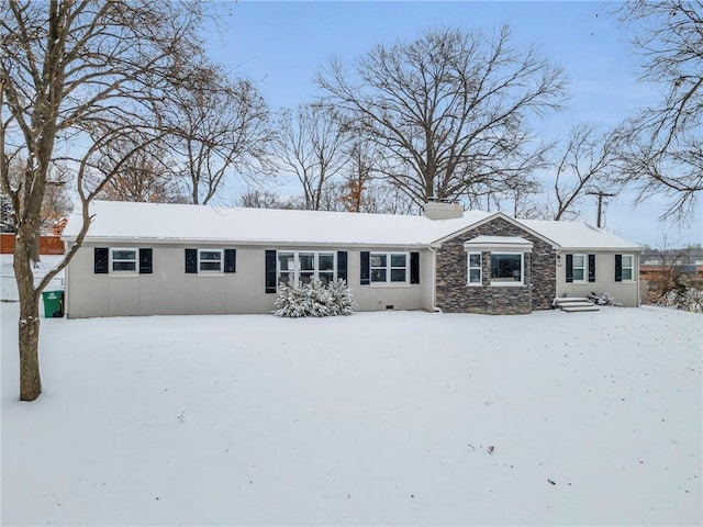 single story home featuring stone siding