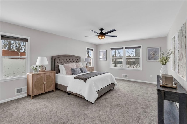 bedroom with ceiling fan, carpet, visible vents, and baseboards